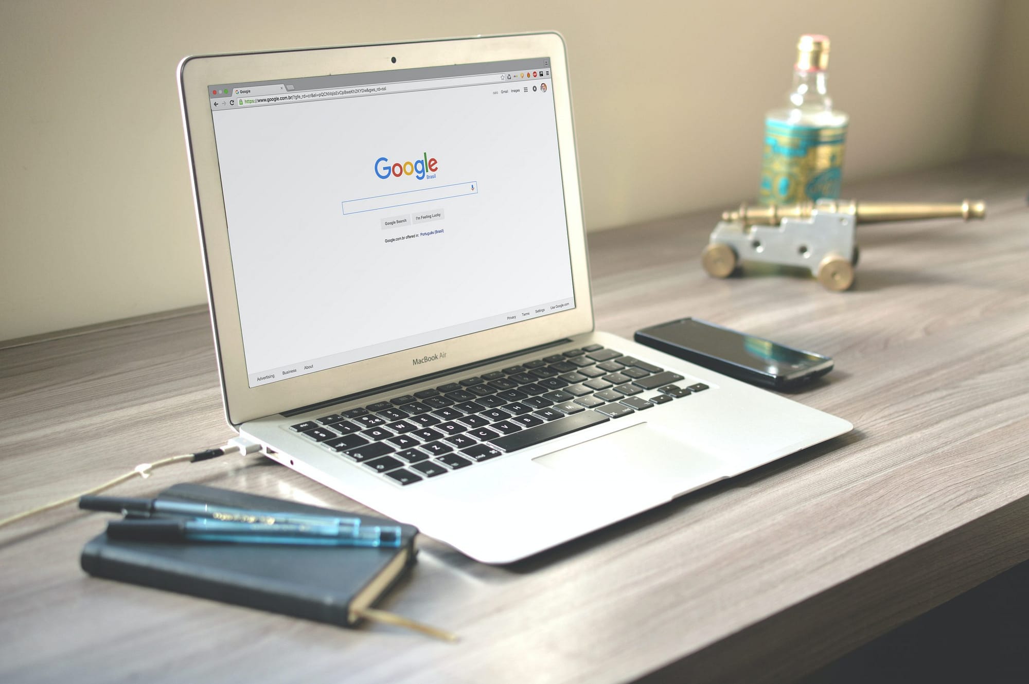 A laptop screen showing Google Search Bar